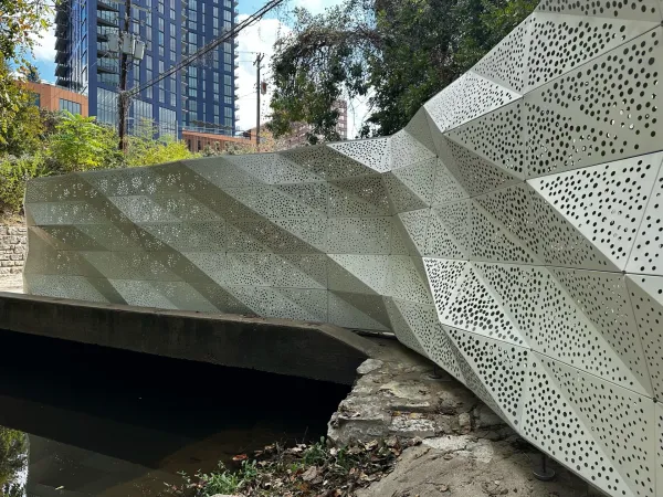 Perforated steel art installation in the daytime