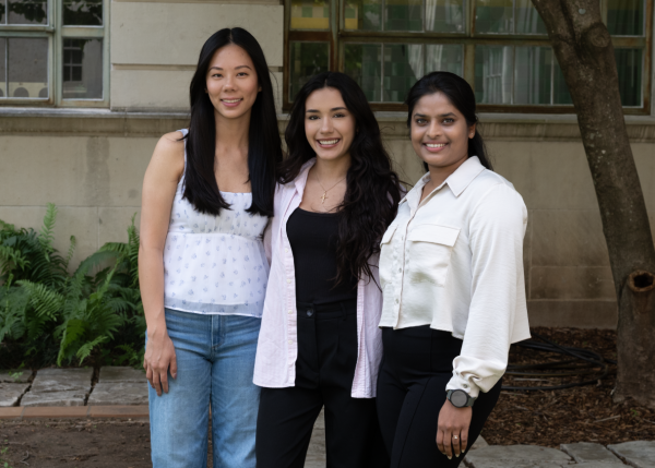 Three women smiling at the camera