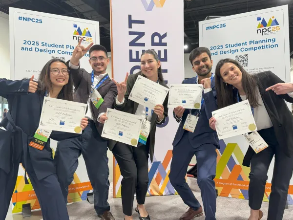 Students holding certificates