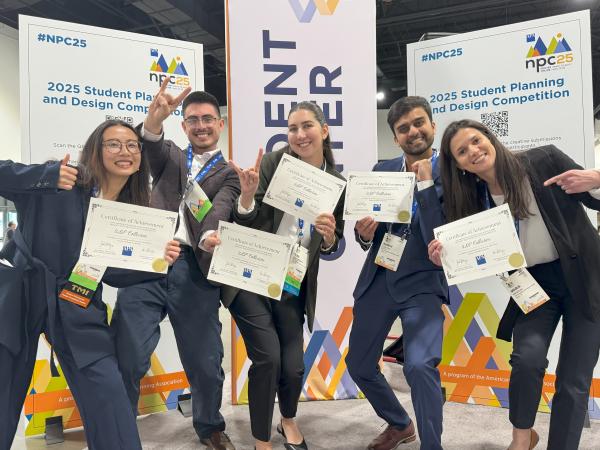 Students holding certificates