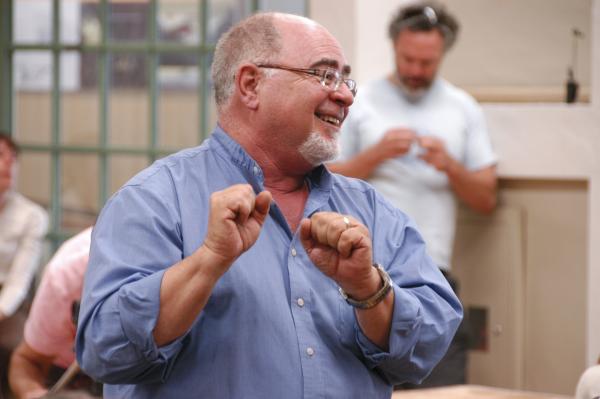 A man animatedly smiling