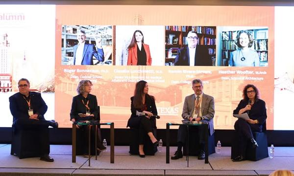 ut faculty sitting on a panel at a summit conference in seoul