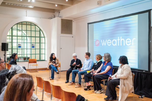 Panelists sitting in front of audience for Weather Interior Design Symposium