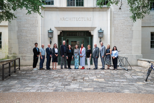 Group of people standing in front of the UT Architecture Building: Goldsmith Hall