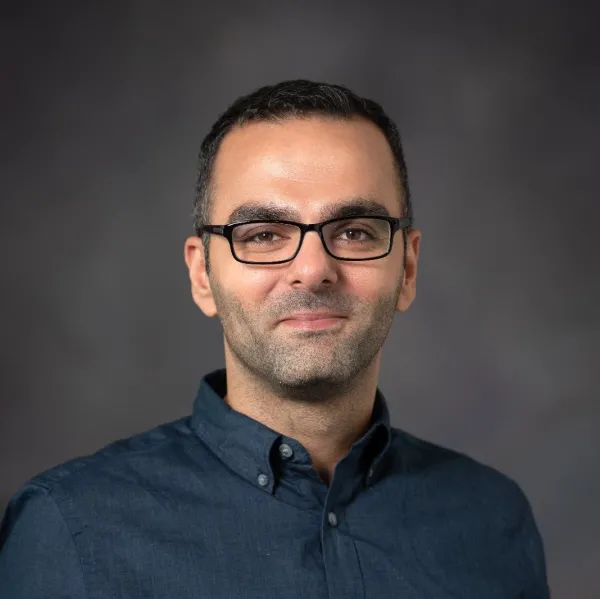 Color headshot of Interior Design alumnus George Fares against a neutral background