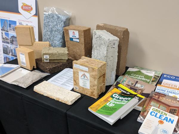 Table showcasing material selections for structural and insulation components. Books pictured were provided by Austin Energy.
