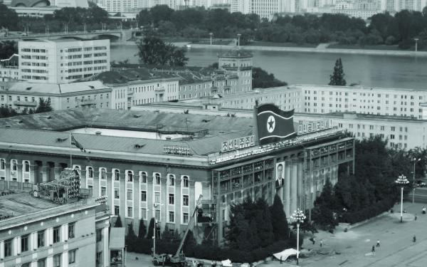 Sepia toned image of a building façade in North Korea