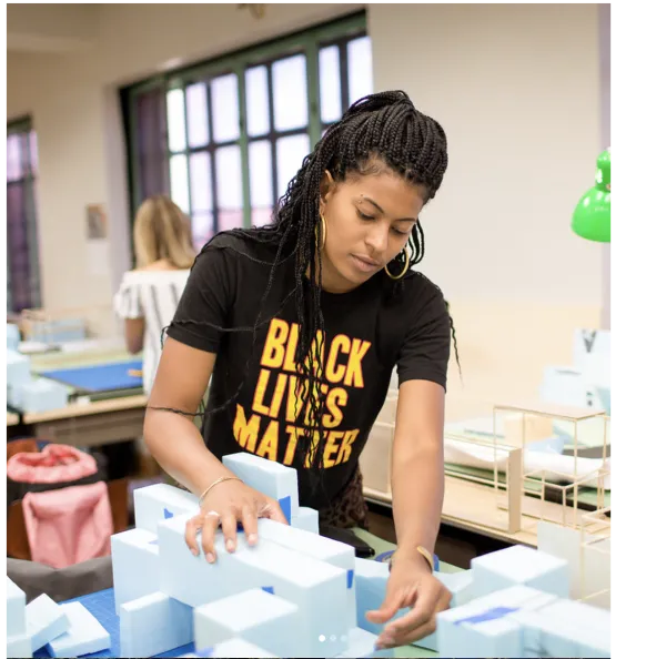 Taylor Davis working in studio wearing a Black Lives Matter shirt