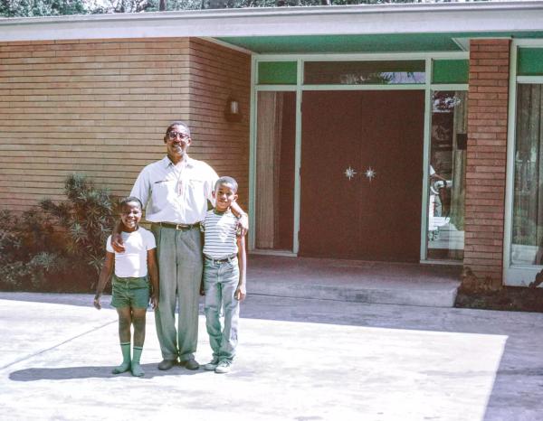 John Chase and his two sons stand in front of their Houston home in the early 1960s