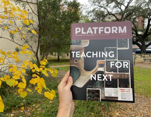 Platform Teaching for Next held up in front of fall foliage outside the School of Architecture