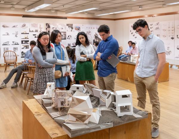 Students standing around a final review