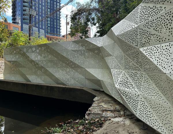 Perforated steel art installation in the daytime