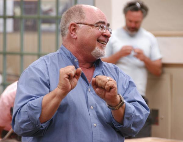 A man animatedly smiling