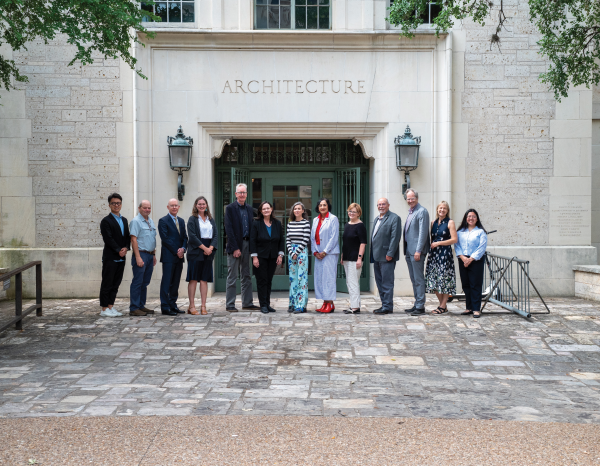 Group of people standing in front of the UT Architecture Building: Goldsmith Hall
