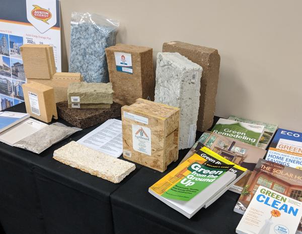 Table showcasing material selections for structural and insulation components. Books pictured were provided by Austin Energy.