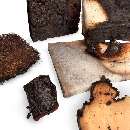 An image featuring varying materials that are in states of burn. They have charred edges but aren't burned fully.