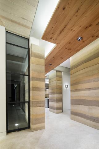 Interior shot of a hallway with many different textures and materials in natural tones