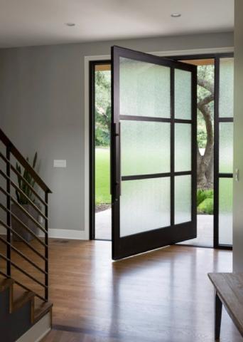 A frosted paneled door stands slightly ajar