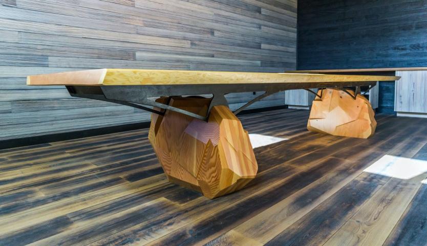 A chunky legged wooden table by Mark Macek