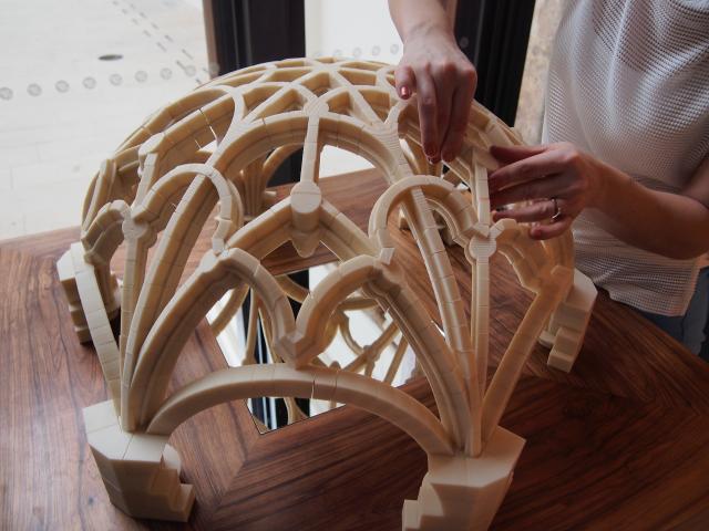 Hands interacting with a 3D printed dome