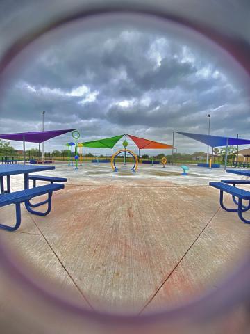 Looking through a fish eye lens on a children's playground on concrete