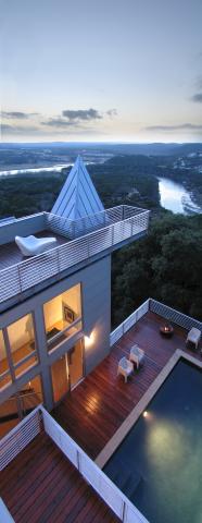 Aerial view of a home's rooftop terrace and outdoor pool