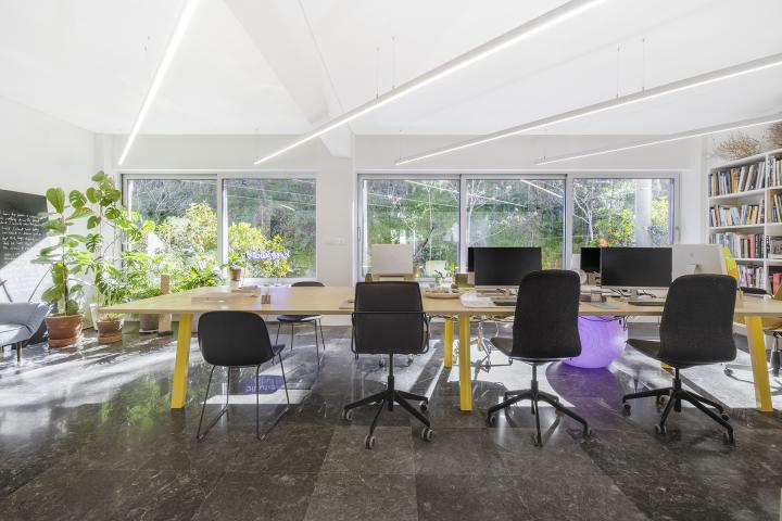 Live-Work Space in Athens, Greece. Working table with view of the Lycabettus hill in the background