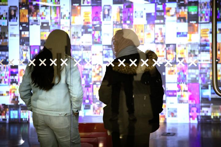 people viewing a projection